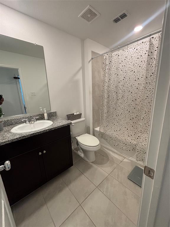 3386 Peyton Lila Road Dallas, TX 75212 - Photo 12 of 13 a bathroom with a double vanity sink toilet and shower