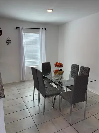 a workspace with furniture and a window