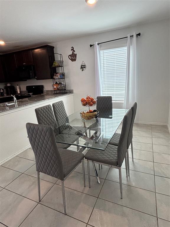 3386 Peyton Lila Road Dallas, TX 75212 - Photo 4 of 13 a dining room with furniture and wooden floor
