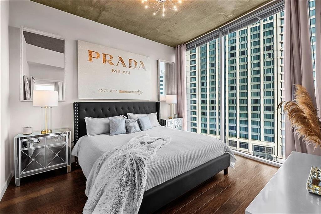 3324 Peachtree Road Northeast, Unit 902 Atlanta, GA 30326 - Photo 12 of 29 a bedroom with a large bed and a large window