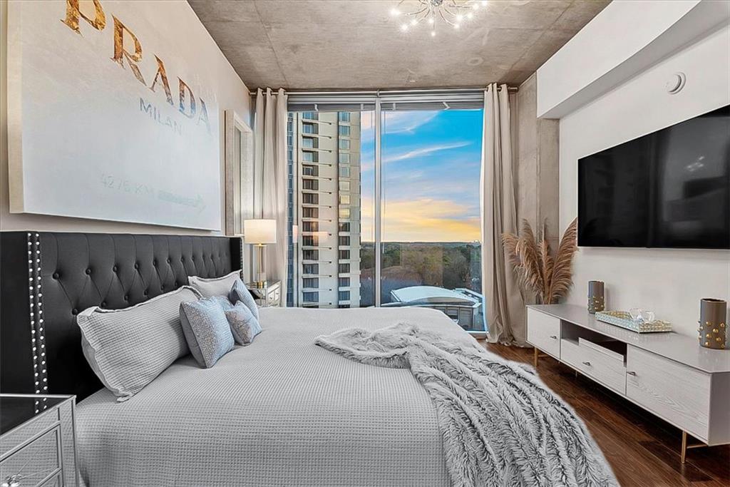 3324 Peachtree Road Northeast, Unit 902 Atlanta, GA 30326 - Photo 13 of 29 a bedroom with a bed and a flat screen tv