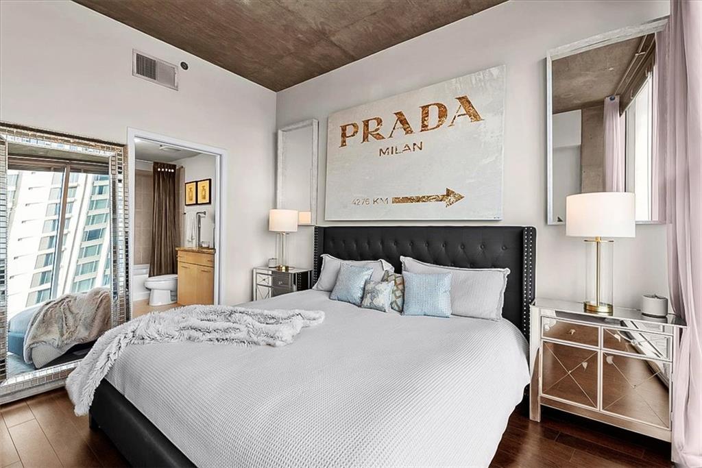 3324 Peachtree Road Northeast, Unit 902 Atlanta, GA 30326 - Photo 14 of 29 a bedroom with a bed and a large window