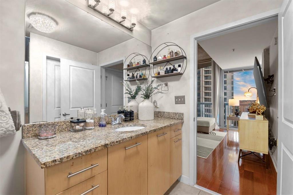 3324 Peachtree Road Northeast, Unit 902 Atlanta, GA 30326 - Photo 17 of 29 a bathroom with double vanity and a mirror