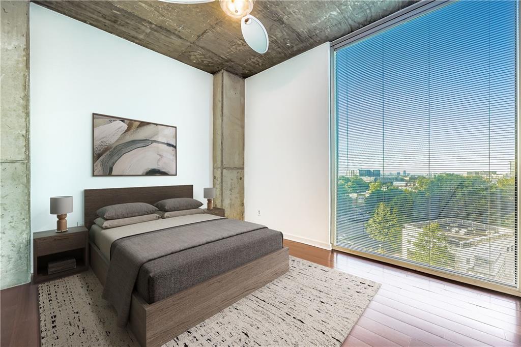 3324 Peachtree Road Northeast, Unit 902 Atlanta, GA 30326 - Photo 19 of 29 a bedroom with a large bed and a painting on the wall