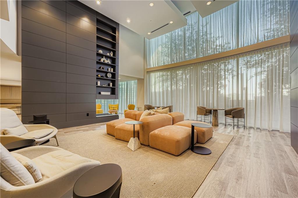 3324 Peachtree Road Northeast, Unit 902 Atlanta, GA 30326 - Photo 22 of 29 a living room with furniture and a large window
