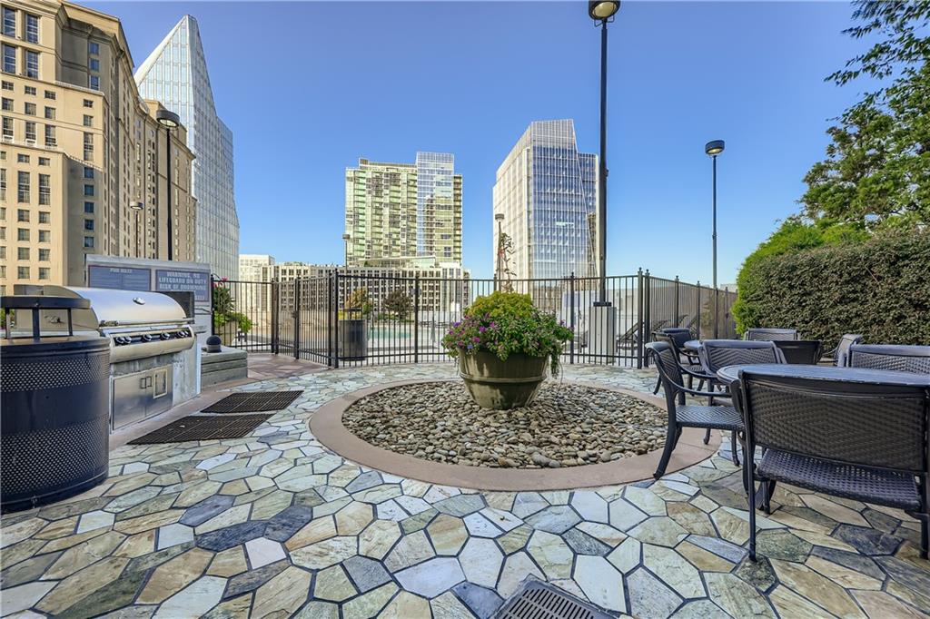 3324 Peachtree Road Northeast, Unit 902 Atlanta, GA 30326 - Photo 24 of 29 a view of dinning table and chairs in the patio