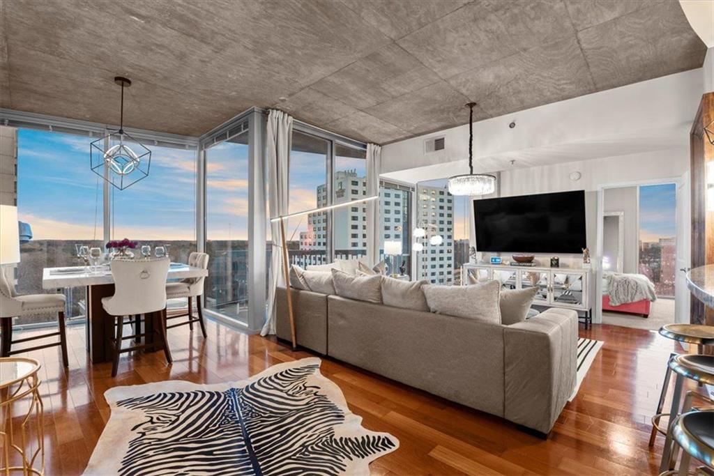 3324 Peachtree Road Northeast, Unit 902 Atlanta, GA 30326 - Photo 3 of 29 a living room with furniture and a flat screen tv