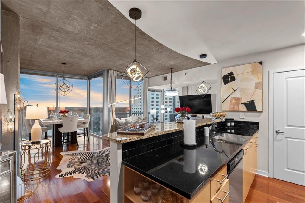 3324 Peachtree Road Northeast, Unit 902 Atlanta, GA 30326 - Photo 5 of 29 a kitchen with stainless steel appliances granite countertop a stove and refrigerator