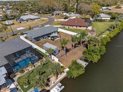 an aerial view of a house with a lake view
