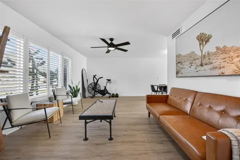 a living room with furniture and a window