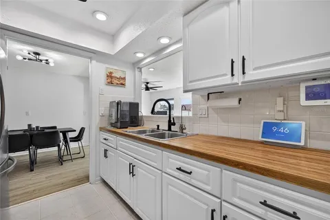 a kitchen with a sink and cabinets