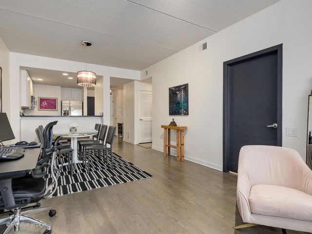 a view of a livingroom with furniture and a flat screen tv
