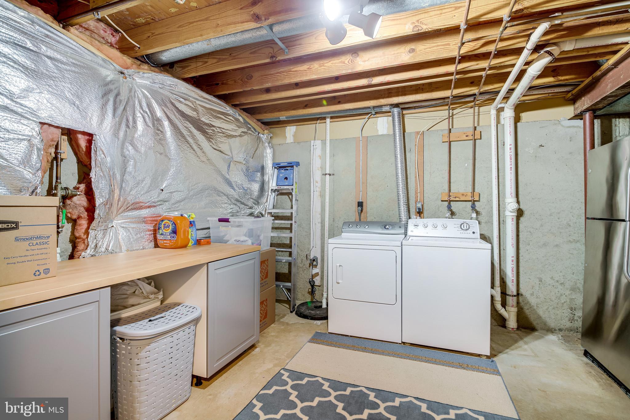 1490 Autumn Ridge Circle Reston, VA 20194 - Photo 43 of 60 Laundry Storage Cabinet conveys