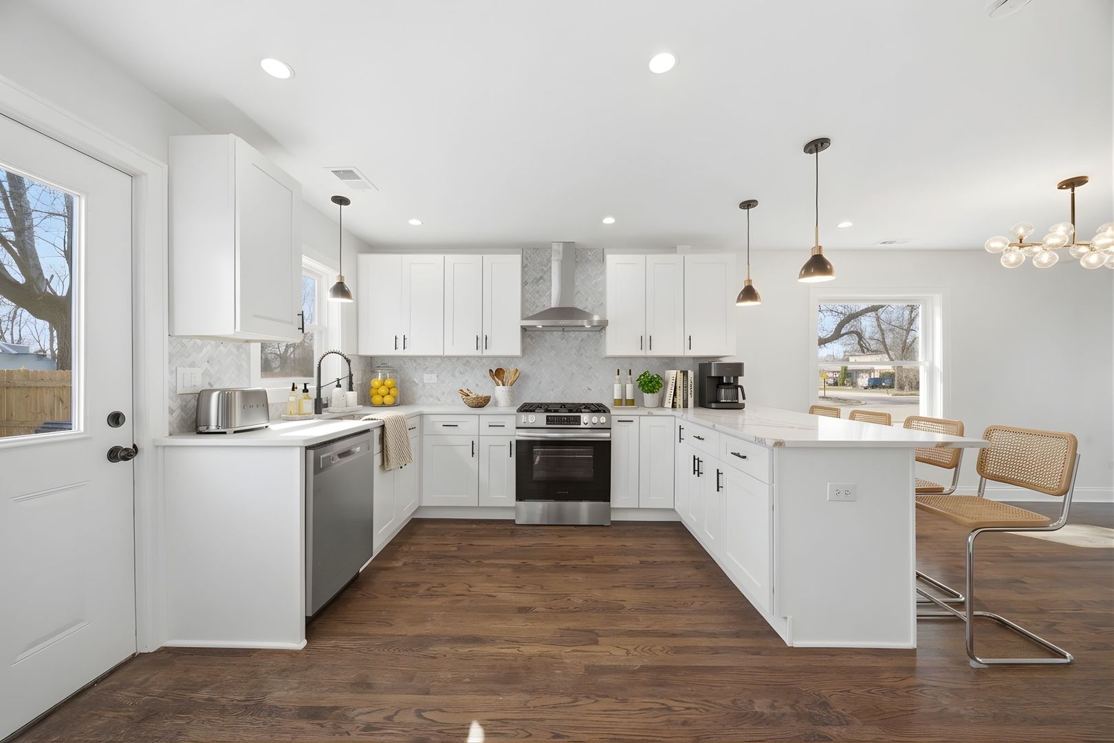 7851 Suburban Lane Bridgeview, IL 60455 - Photo 11 of 50 a kitchen with white cabinets and white appliances