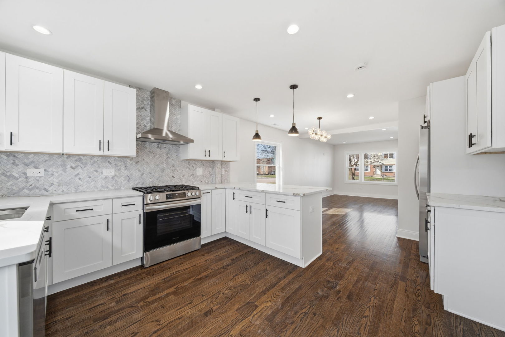 7851 Suburban Lane Bridgeview, IL 60455 - Photo 12 of 50 a kitchen with a hard wood floor white cabinets and stainless steel appliances