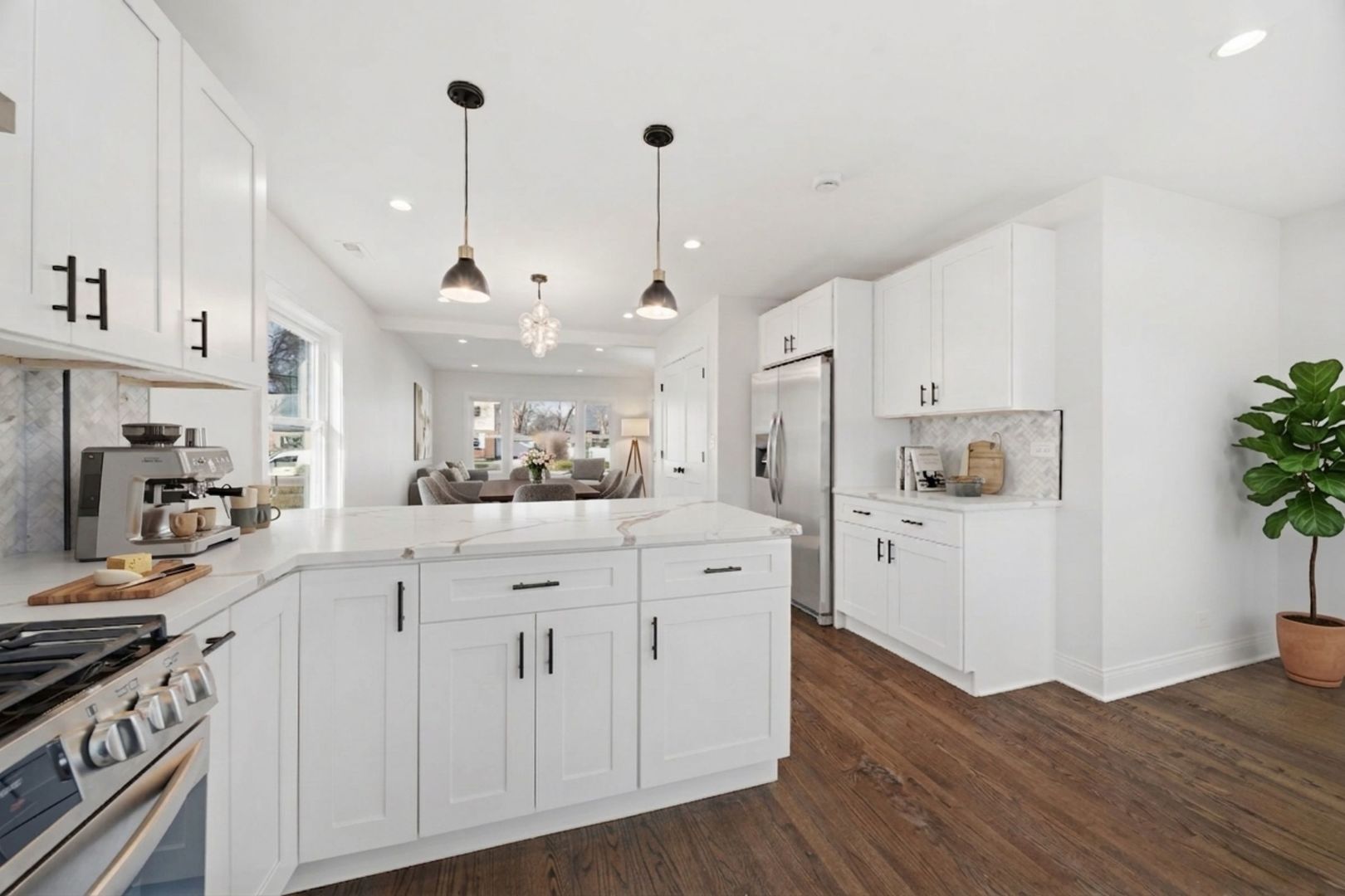 7851 Suburban Lane Bridgeview, IL 60455 - Photo 15 of 50 a kitchen with stainless steel appliances white cabinets and wooden floors
