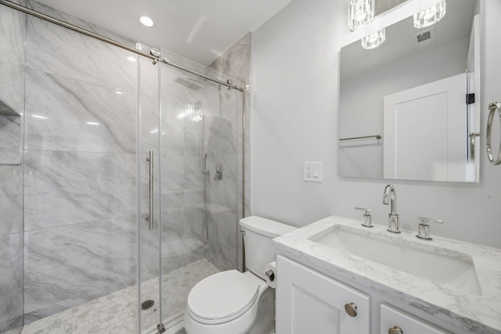 7851 Suburban Lane Bridgeview, IL 60455 - Photo 18 of 50 a bathroom with a sink toilet and shower