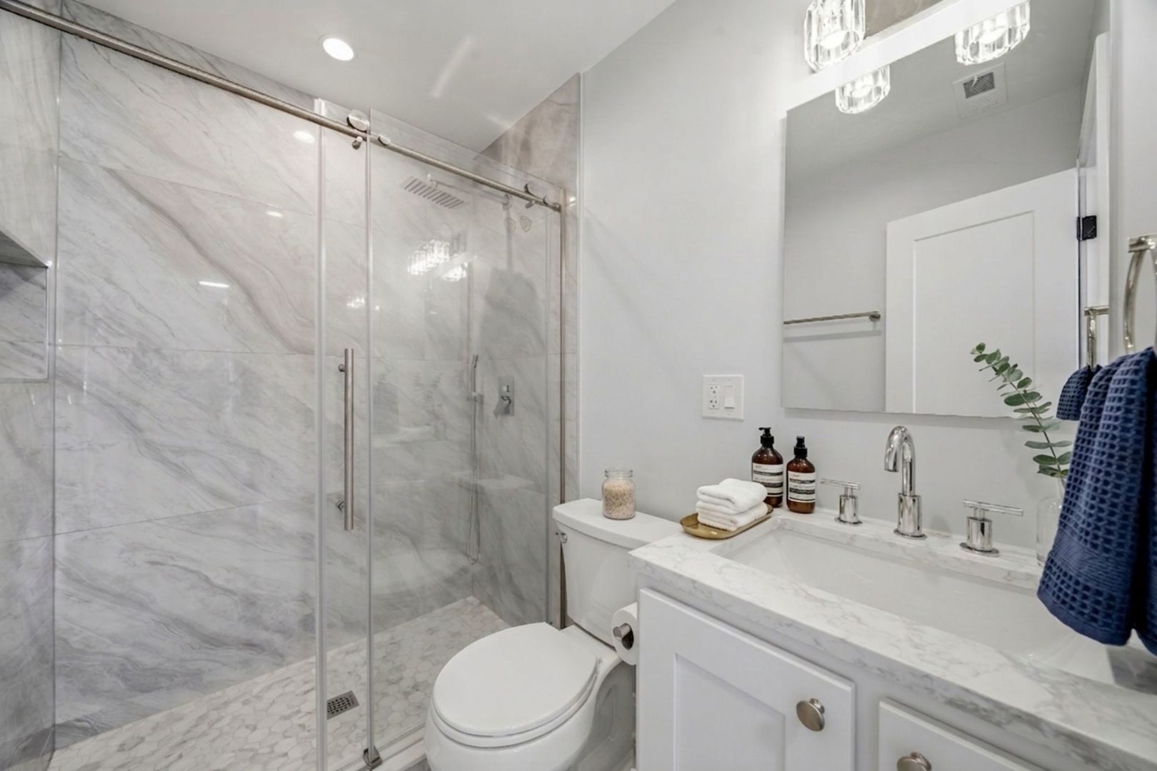 7851 Suburban Lane Bridgeview, IL 60455 - Photo 19 of 50 a bathroom with a sink a toilet and shower