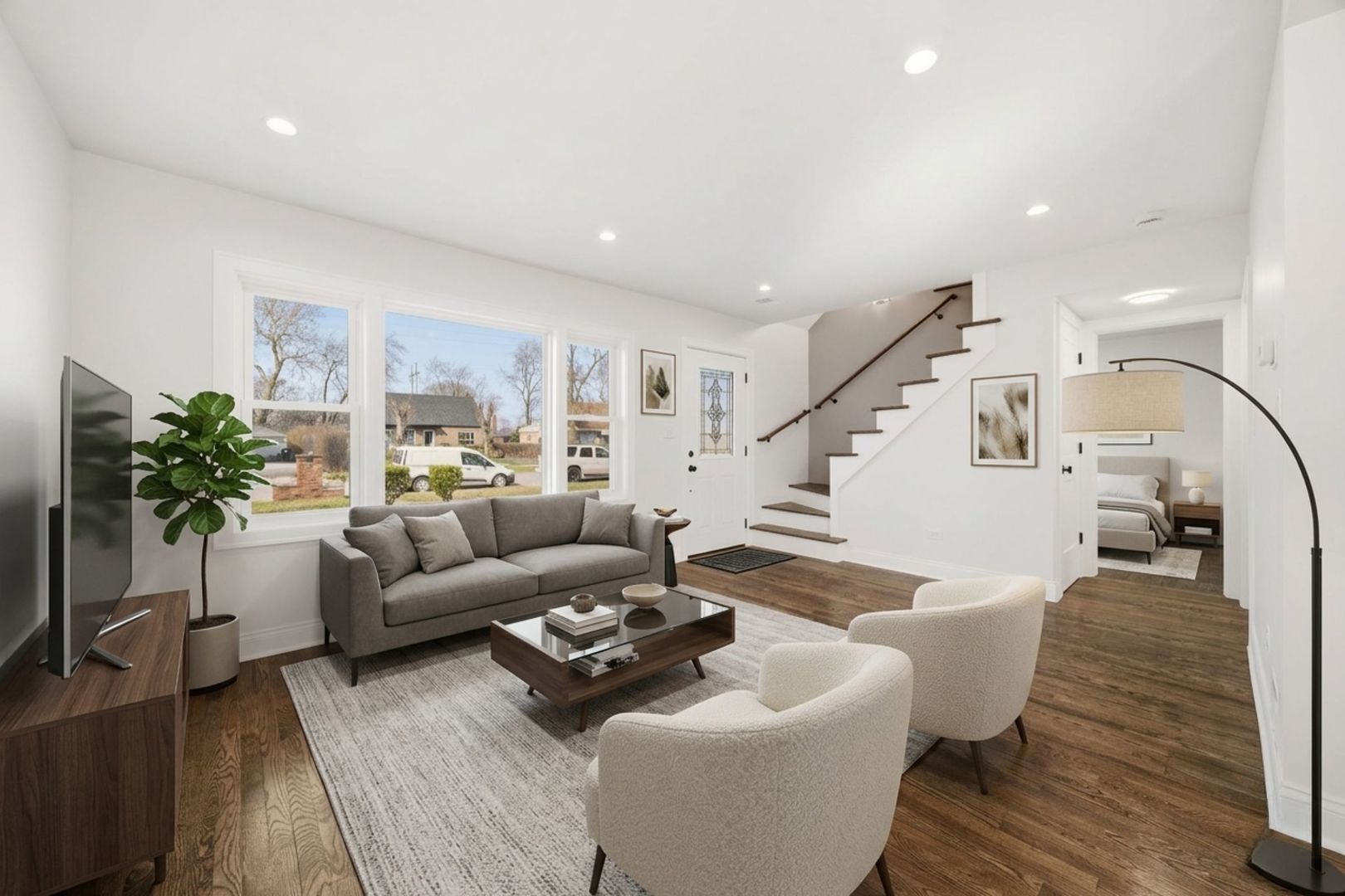 7851 Suburban Lane Bridgeview, IL 60455 - Photo 2 of 50 a living room with furniture and wooden floor