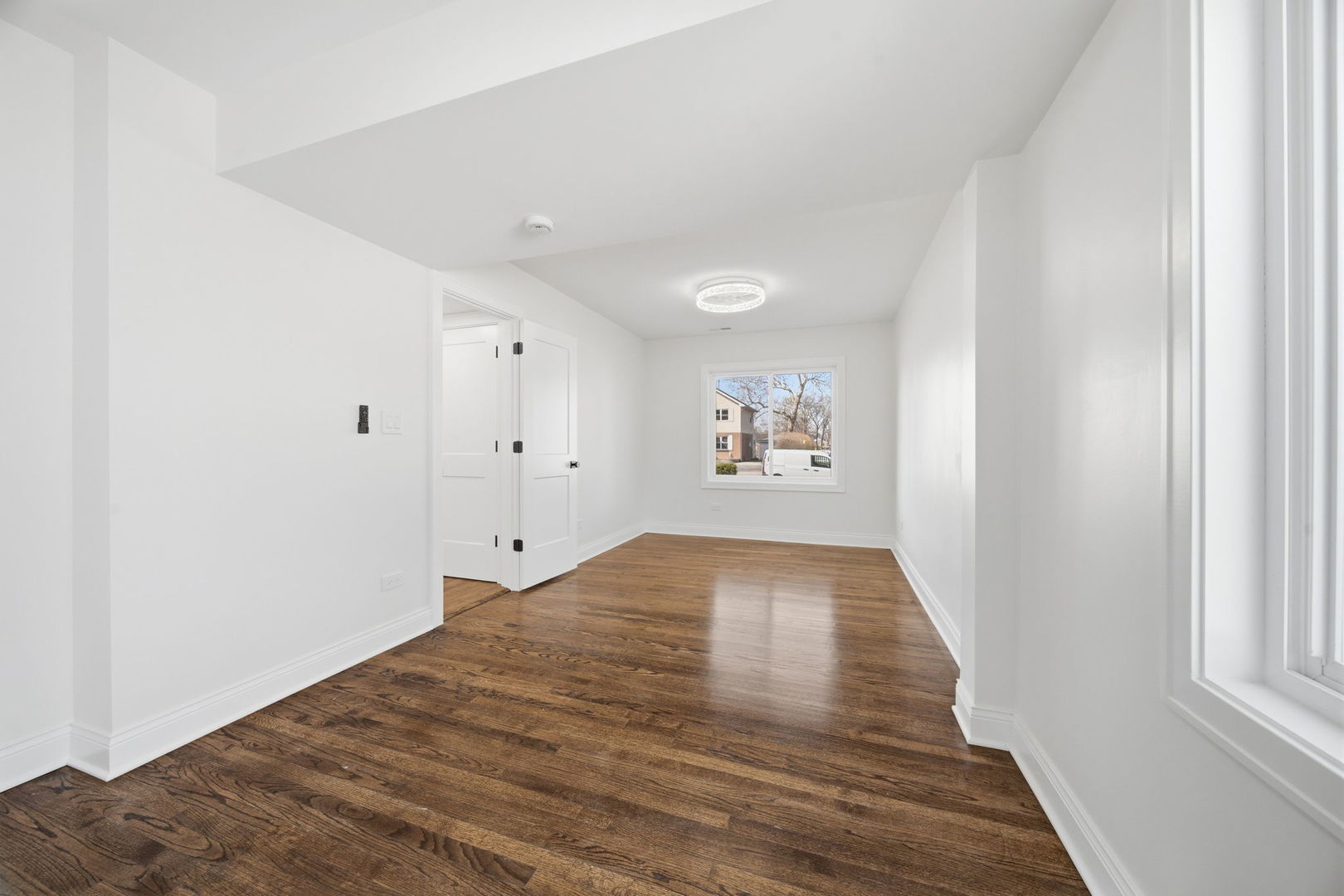 7851 Suburban Lane Bridgeview, IL 60455 - Photo 22 of 50 a view of empty room with wooden floor