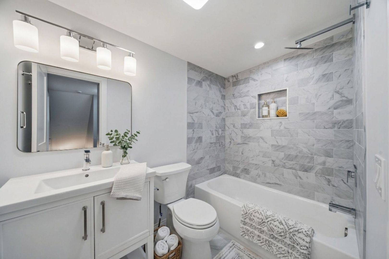 7851 Suburban Lane Bridgeview, IL 60455 - Photo 26 of 50 a bathroom with a sink a toilet and shower