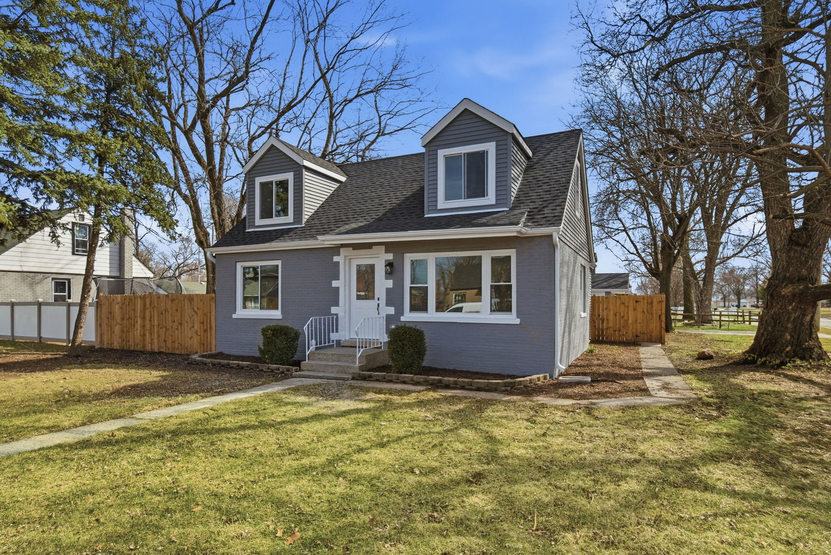 7851 Suburban Lane Bridgeview, IL 60455 - Photo 36 of 50 a front view of a house with a yard