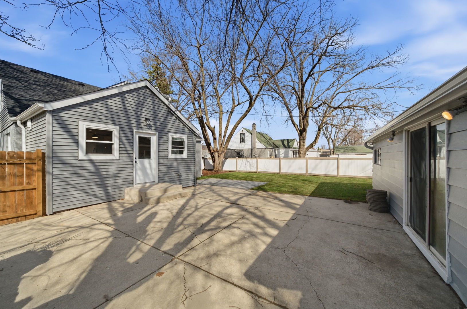7851 Suburban Lane Bridgeview, IL 60455 - Photo 39 of 50 a view of a white house with a large tree