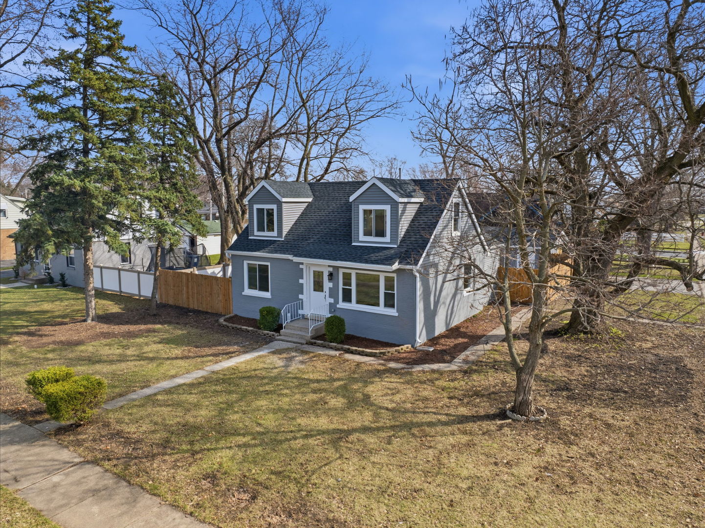 7851 Suburban Lane Bridgeview, IL 60455 - Photo 42 of 50 a front view of a house with a yard
