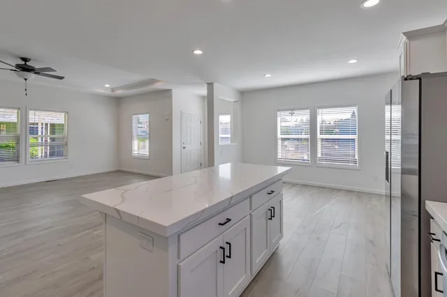 a view of a kitchen cabinets and wooden floor