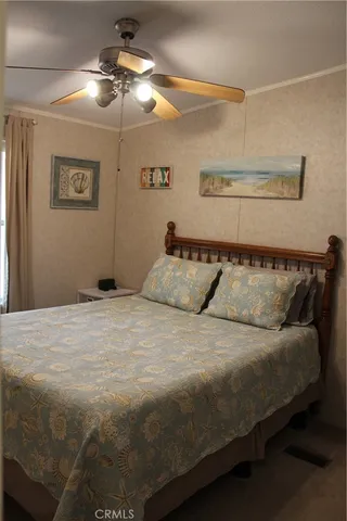 a view of a chandelier fan and kitchen in the house