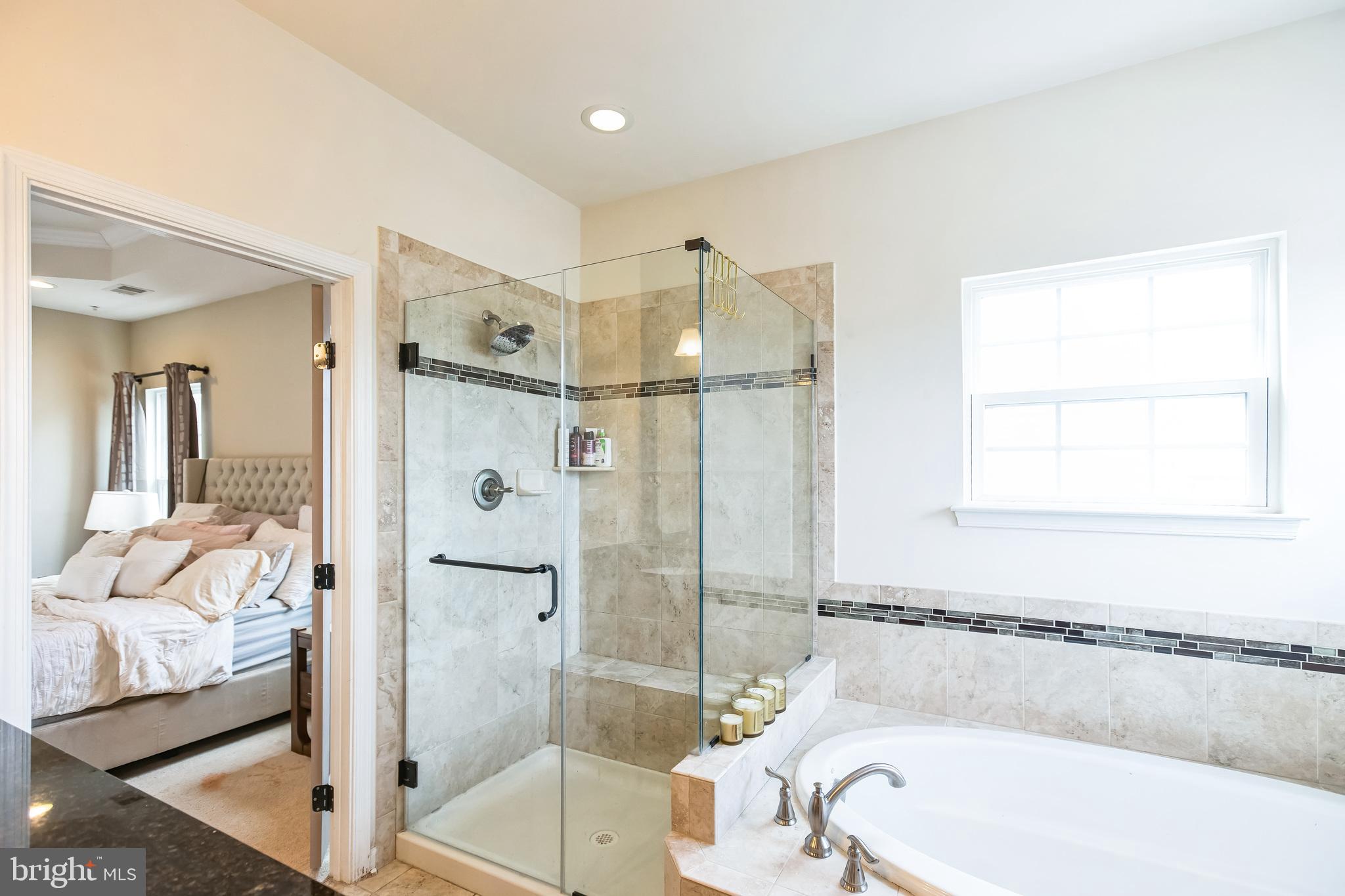 2601 St Marys View Road Accokeek, MD 20607 - Photo 19 of 33 a bathroom with a tub a toilet and a shower