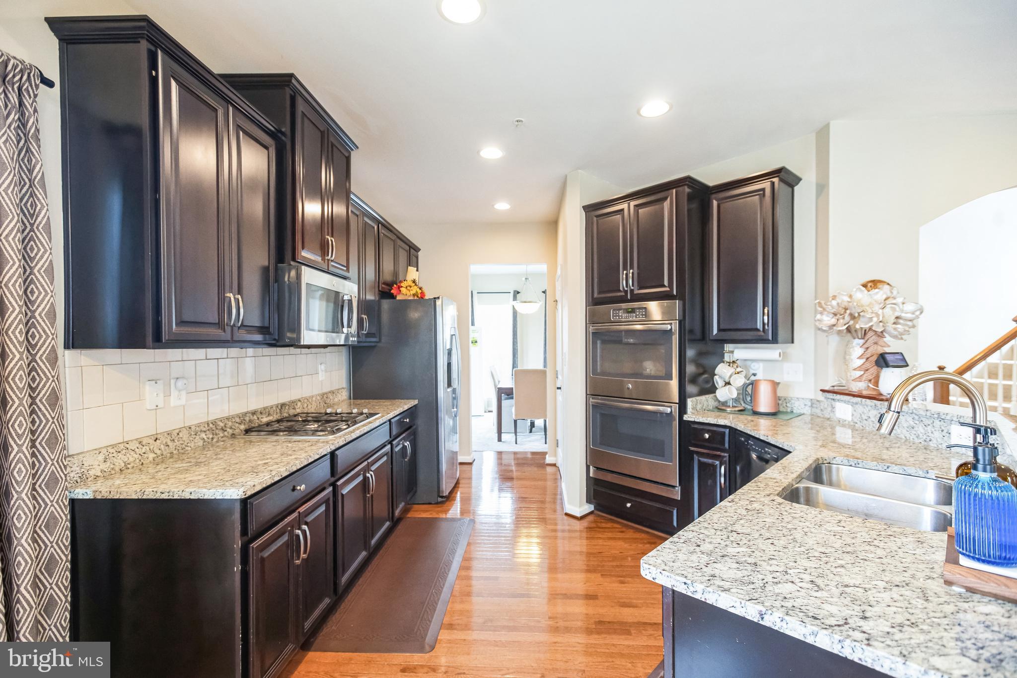 2601 St Marys View Road Accokeek, MD 20607 - Photo 3 of 33 a kitchen with stainless steel appliances granite countertop a stove and a refrigerator