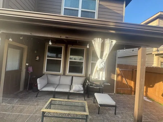 a view of a porch with furniture