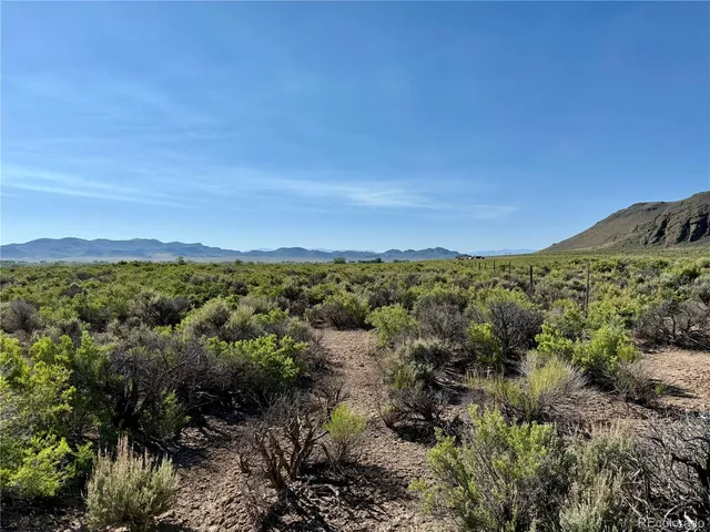 a view of a city with mountains in the background