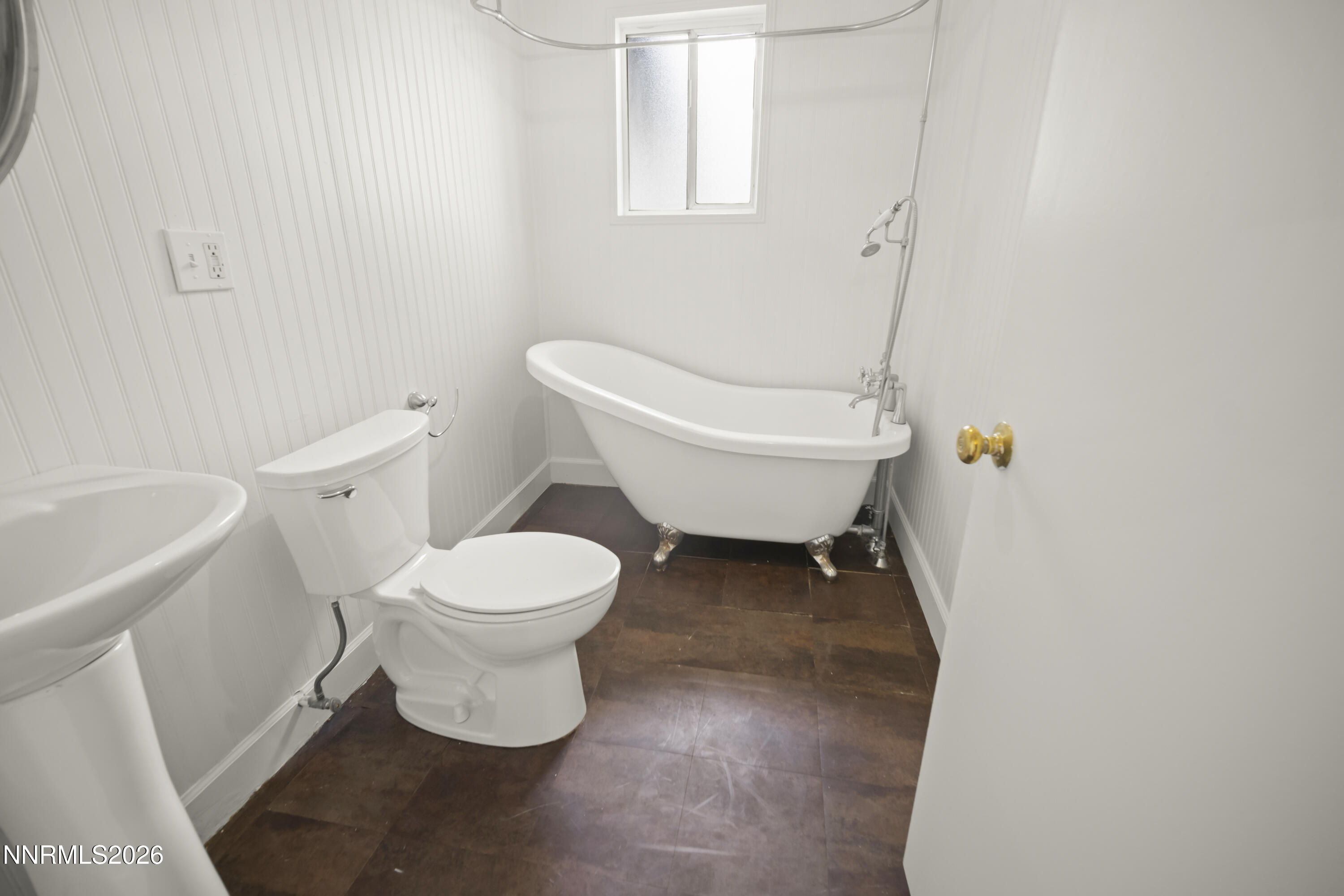 511 Churchill Street Fallon, NV 89406 - Photo 12 of 37 a white toilet sitting next to a white sink and vanity