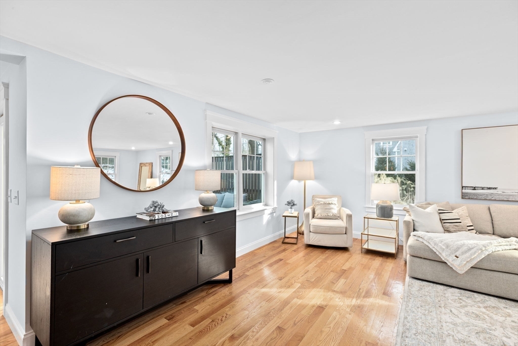 54 Dreamwold Road Scituate, MA 02066 - Photo 14 of 41 a living room with furniture a mirror and a large window