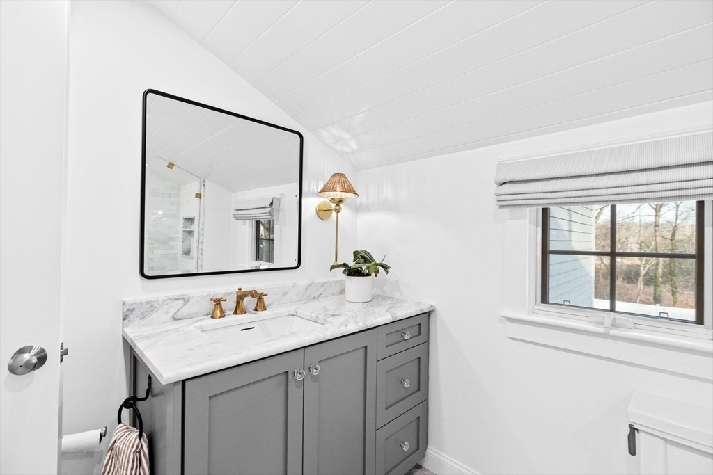 54 Dreamwold Road Scituate, MA 02066 - Photo 18 of 41 a bathroom with a sink and a mirror