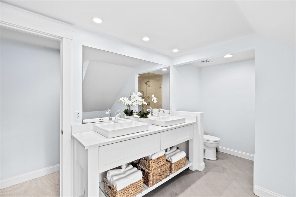 54 Dreamwold Road Scituate, MA 02066 - Photo 25 of 41 a room with a sink and a toilet