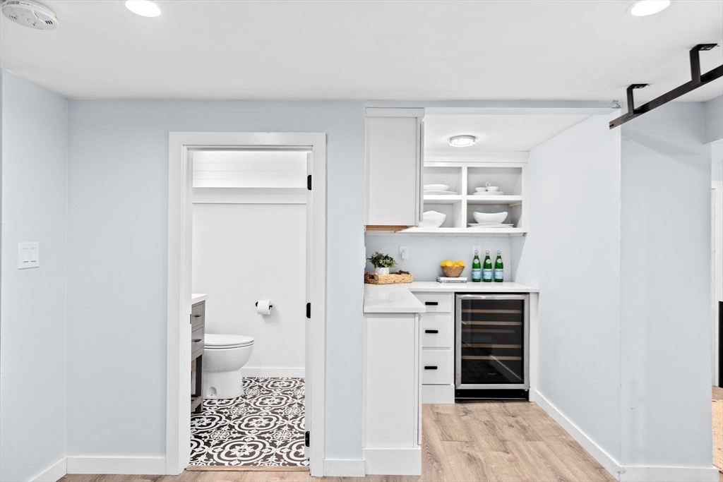 54 Dreamwold Road Scituate, MA 02066 - Photo 29 of 41 a room with a white walls and a wooden floor