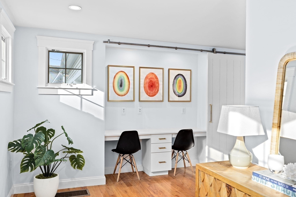 54 Dreamwold Road Scituate, MA 02066 - Photo 3 of 41 a view of a workspace with furniture and wooden floor