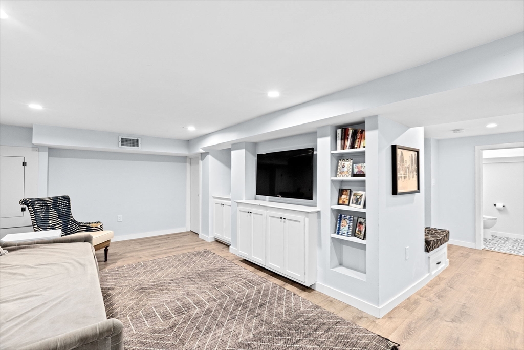 54 Dreamwold Road Scituate, MA 02066 - Photo 33 of 41 a living room with furniture and a flat screen tv