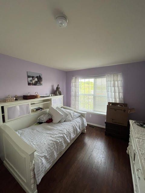 2212 Rising Hill Road Whitehall, PA 18052 - Photo 15 of 21 Well-lit sleeping quarters with rich hardwood flooring and a functional built-in headboard.