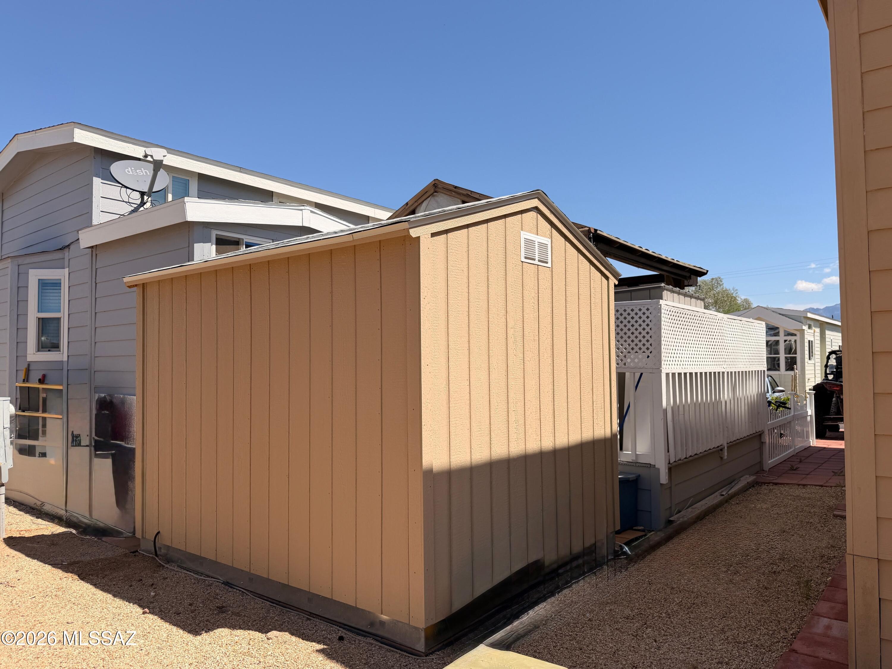 2843 19 Interstate 19 Frontage Road, Unit 116 Amado, AZ 85645 - Photo 31 of 32 a view of a house with a backyard