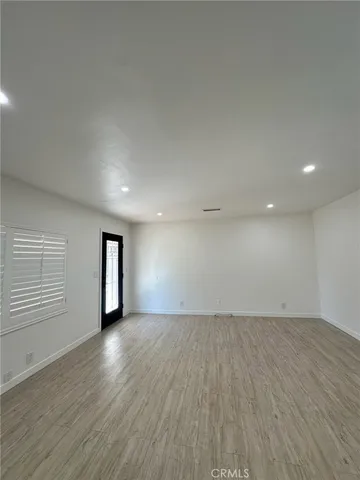 a large kitchen with a stove a refrigerator and a sink