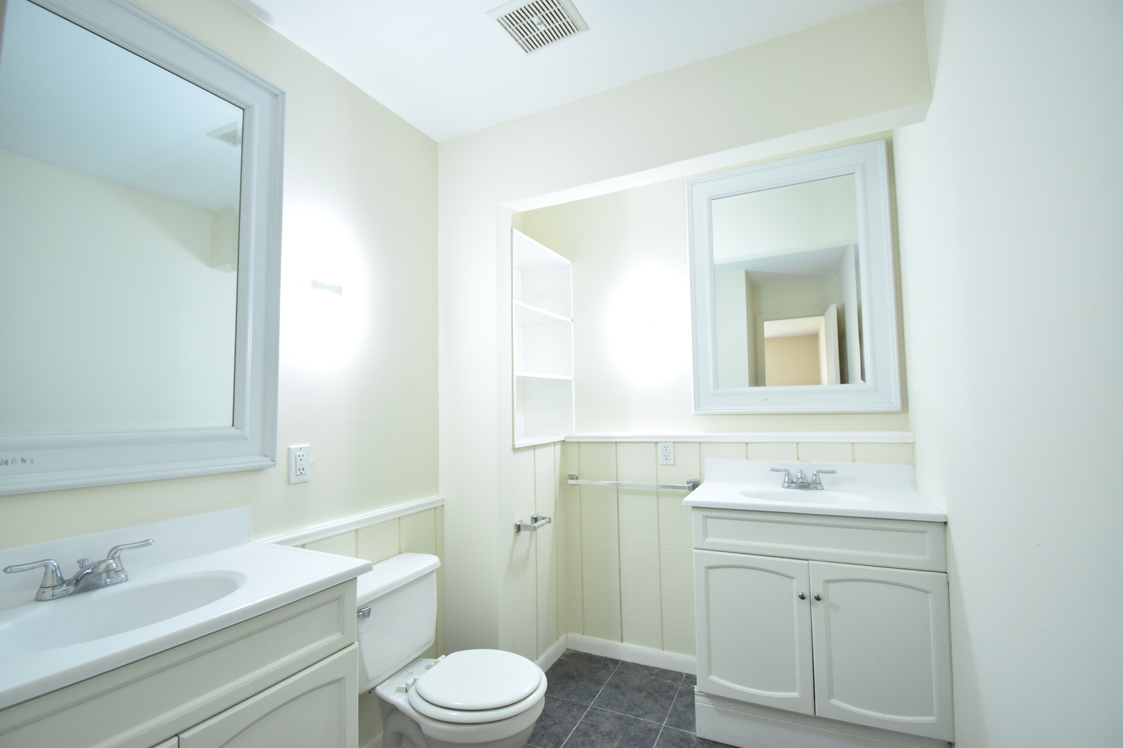 4618 Northfox Lane, Unit 6 McHenry, IL 60050 - Photo 13 of 15 a bathroom with a granite countertop toilet sink vanity and mirror