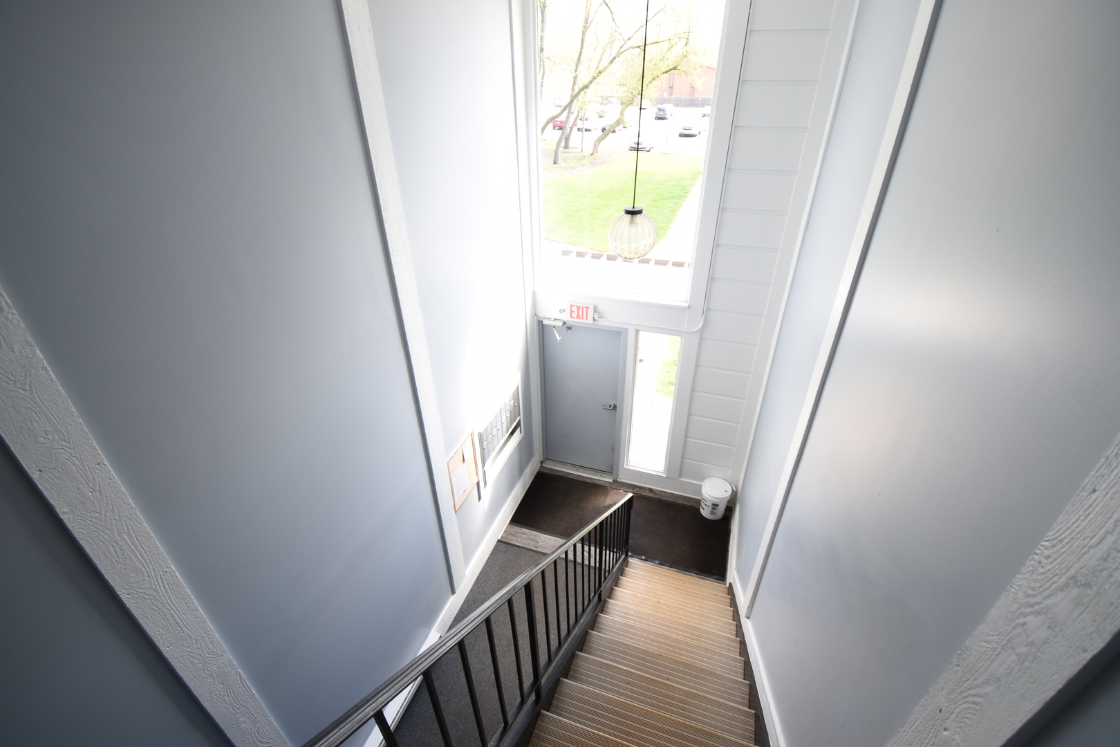 4618 Northfox Lane, Unit 6 McHenry, IL 60050 - Photo 14 of 15 a view of a hallway with wooden floor and stairs