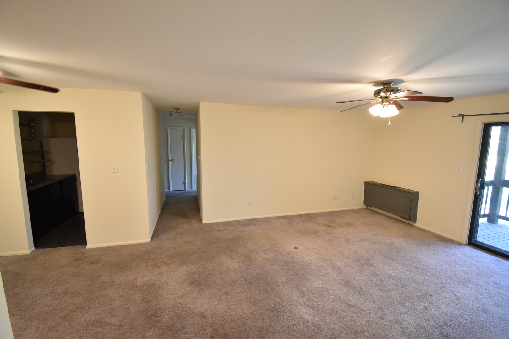 4618 Northfox Lane, Unit 6 McHenry, IL 60050 - Photo 3 of 15 an empty room with closet and a ceiling fan
