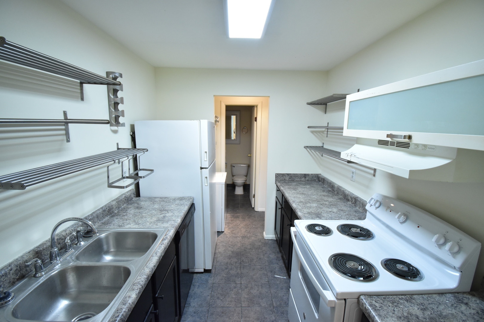 4618 Northfox Lane, Unit 6 McHenry, IL 60050 - Photo 5 of 15 a kitchen with kitchen island a sink stove and refrigerator