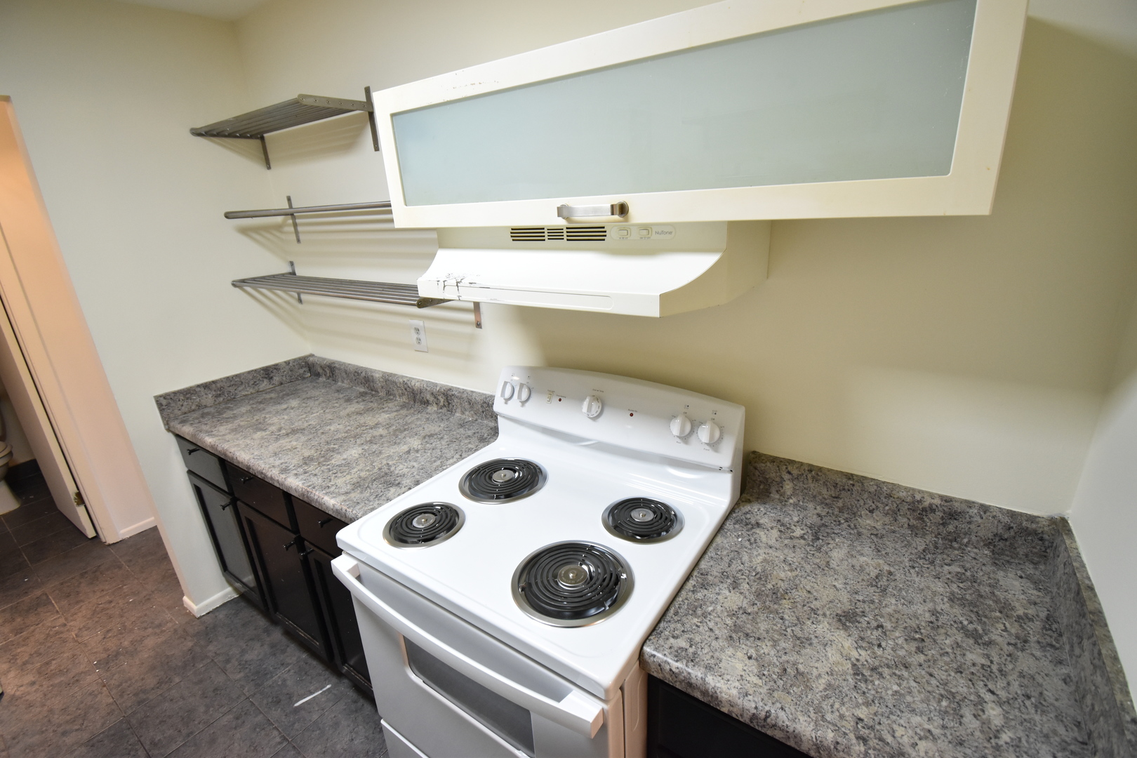 4618 Northfox Lane, Unit 6 McHenry, IL 60050 - Photo 6 of 15 a bath room with a sink and a stove