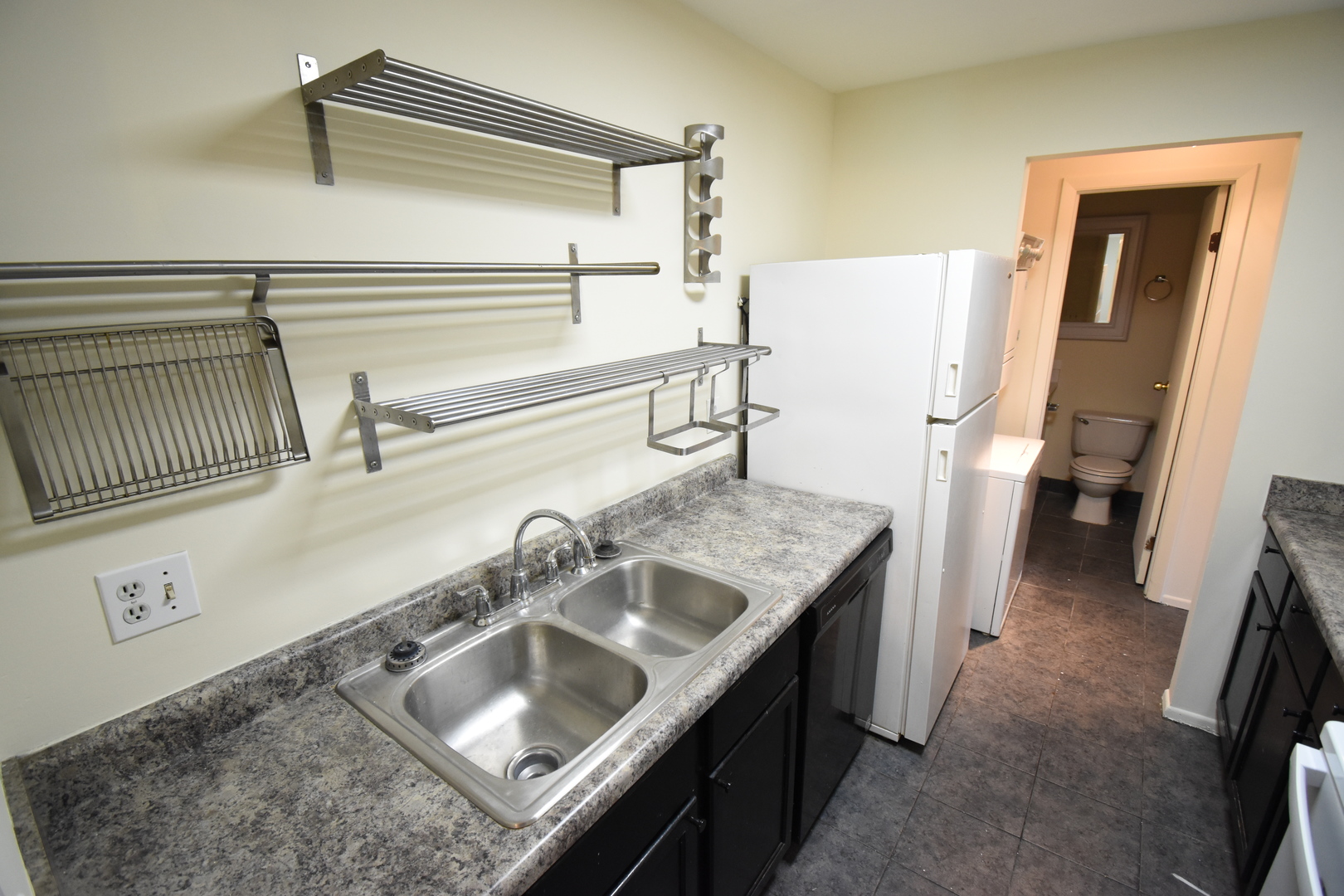 4618 Northfox Lane, Unit 6 McHenry, IL 60050 - Photo 7 of 15 a bathroom with a sink and a mirror
